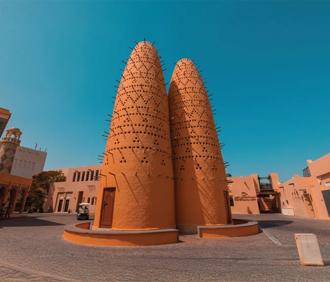 Katara Cultural Village in Doha, featuring traditional architecture, an open-air amphitheater, and cultural spaces blending heritage with modern attractions.
