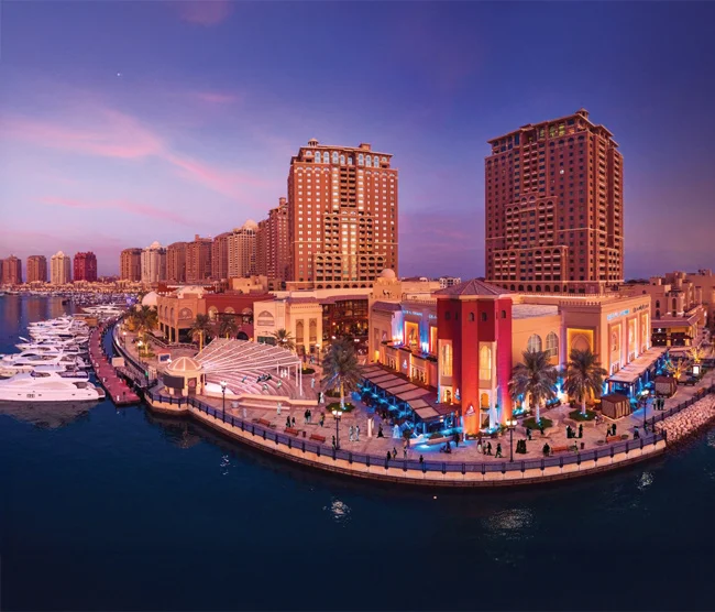The Pearl Island in Doha, a luxury man-made waterfront community with marinas, residential towers, and shopping promenades.