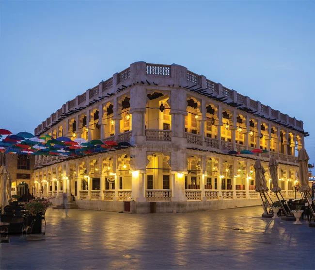 Souq Waqif in Doha, filled with spice stalls, traditional shops, and lively cafés showcasing Qatari culture and heritage.
