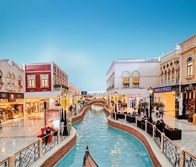 Villaggio Mall in Doha, featuring Venetian-inspired architecture with painted sky ceilings, luxury shops, and an indoor gondola canal.